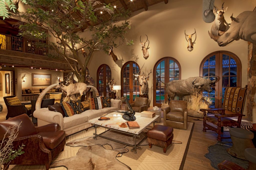 Large room with vaulted ceiling and animal heads on the wall.