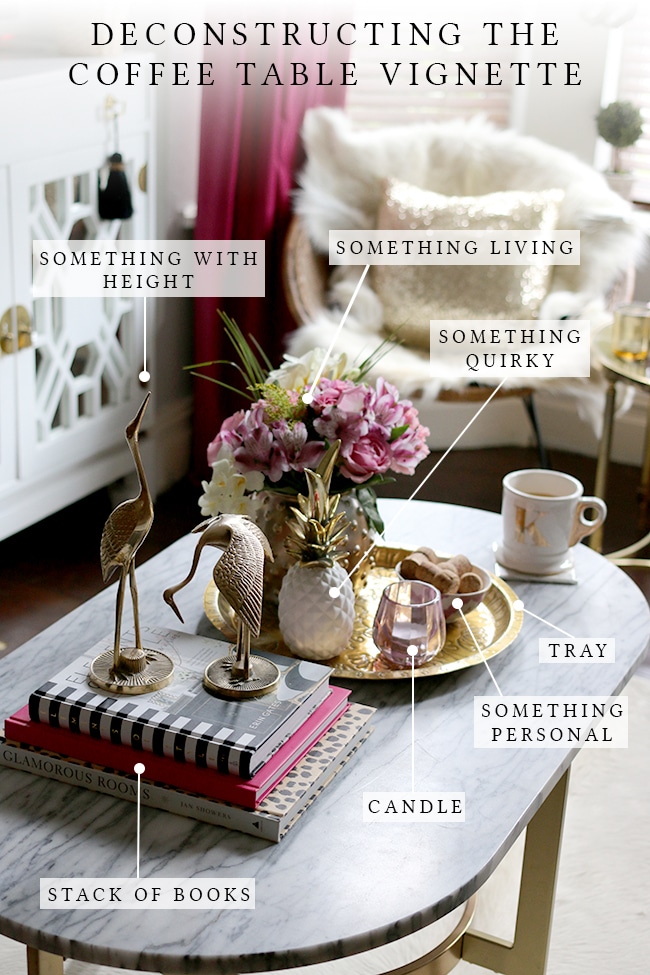 Stylish coffee table with various accessories on top.